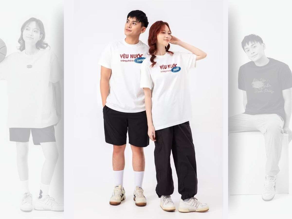 Người mẫu nam phối đồ với áo thun Việt Nam của Coolmate cùng quần short và sneaker năng động
