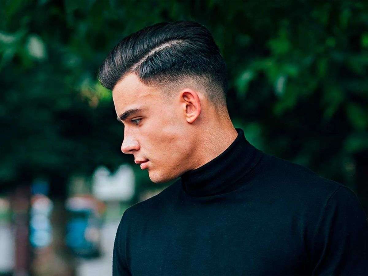 Comb Over Fade là kiểu tóc rẽ ngôi lệch kết hợp với kỹ thuật fade ở hai bên