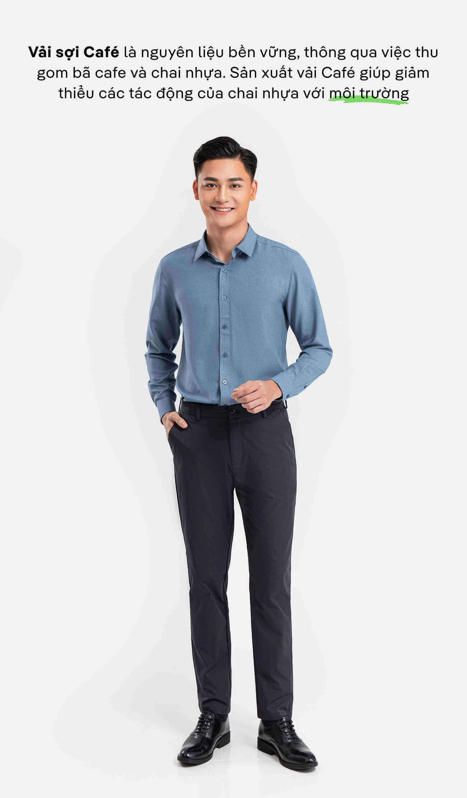 Người mẫu nam mặc áo sơ mi Café-DriS màu xanh đậm phối quần tây, thể hiện phong cách công sở bền vững.